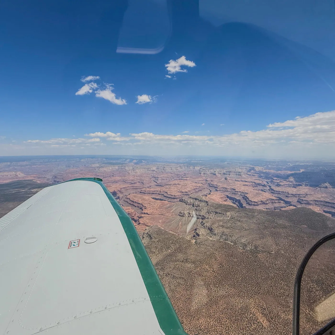 The Grand Canyon seen past the wing on a clear afternoon