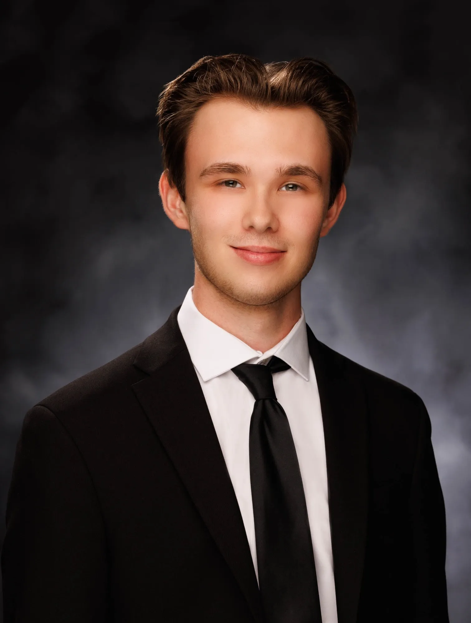 Portrait of Brandon J. Dorsey in a dark suit and tie