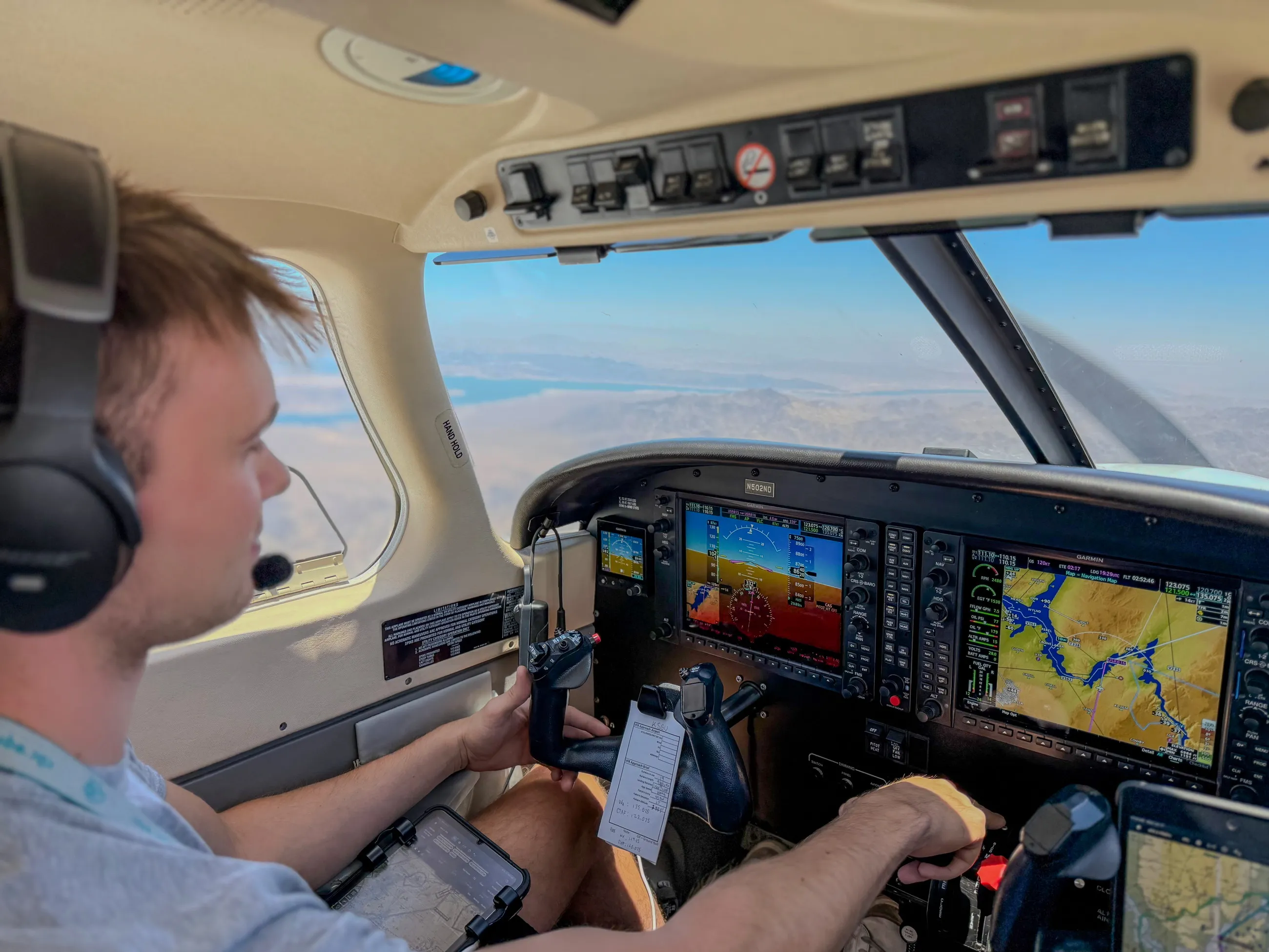 Brandon at the controls in cruise over the Arizona desert