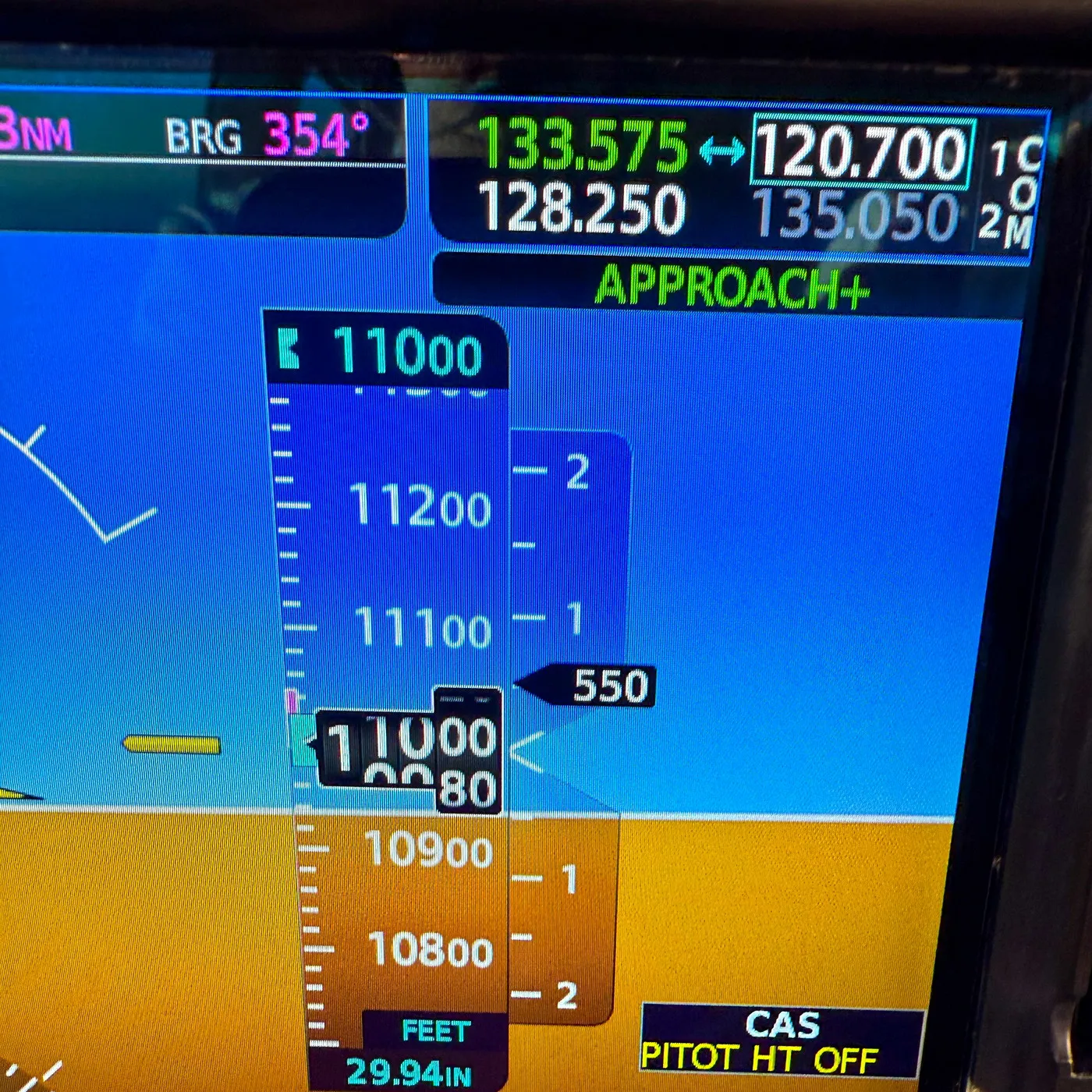 A primary flight display showing eleven thousand feet and a level attitude